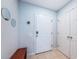 Home entryway featuring modern digital lock, convenient storage closet and decoratively mirrored wall at 805 100Th N Ave, St Petersburg, FL 33702