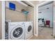 Laundry room with modern washer and dryer, also showing an office space through the doorway at 805 100Th N Ave, St Petersburg, FL 33702