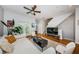 A bright living room features hardwood floors and staircase, with a comfortable white couch and modern decor at 805 100Th N Ave, St Petersburg, FL 33702
