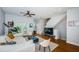 Inviting living room with comfortable seating, hardwood floors, and a modern ceiling fan at 805 100Th N Ave, St Petersburg, FL 33702