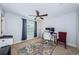The bedroom has a ceiling fan, a desk, a printer, and an accent rug that add character to the space at 805 100Th N Ave, St Petersburg, FL 33702