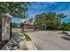 Gated community entrance, showing townhomes in the background and well-maintained landscaping at 805 100Th N Ave, St Petersburg, FL 33702