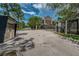Gated community entrance with keypad entry, signage, and well-maintained landscaping at 805 100Th N Ave, St Petersburg, FL 33702