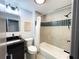 A fully renovated bathroom with modern fixtures and a tiled tub-shower combination at 8303 N 17Th St, Tampa, FL 33604