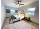 Inviting bedroom featuring neutral walls, carpet, and ample natural light from multiple windows at 8303 N 17Th St, Tampa, FL 33604