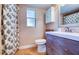 Bathroom with updated vanity, neutral walls, and a coordinating shower curtain for a clean and functional space at 8798 94Th St, Seminole, FL 33777