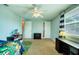 Cheerful bedroom with fun decor, a ceiling fan, and ample storage space at 8798 94Th St, Seminole, FL 33777
