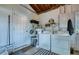 Functional laundry room with washer, dryer, and ample storage space at 8798 94Th St, Seminole, FL 33777