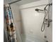 Shower and bathtub with a white tile surround and sleek shower fixtures at 880 Mandalay Ave # C704, Clearwater Beach, FL 33767