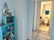 Bright bathroom featuring a toilet and vanity, with beach-themed decorations at 880 Mandalay Ave # C704, Clearwater Beach, FL 33767