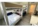 Nautical-themed bedroom featuring white bunk beds, bedside table, and dresser at 880 Mandalay Ave # C704, Clearwater Beach, FL 33767