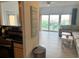 Bright living room with ocean view balcony access, and coastal decor at 880 Mandalay Ave # C704, Clearwater Beach, FL 33767