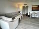 Comfortable living room featuring an open kitchen and dining area at 880 Mandalay Ave # C704, Clearwater Beach, FL 33767