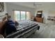 Bedroom with balcony access overlooking city views at 880 Mandalay Ave # C704, Clearwater Beach, FL 33767