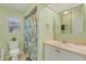 Light-green bathroom with a shower and vanity with ample storage at 890 Coronado Dr, Punta Gorda, FL 33950