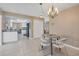 Bright kitchen featuring modern appliances, white cabinetry, and a cozy dining area at 890 Coronado Dr, Punta Gorda, FL 33950