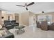 Open-concept living space with comfortable leather seating and dining area at 890 Coronado Dr, Punta Gorda, FL 33950
