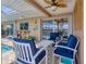 Cozy outdoor patio with comfortable seating, perfect for relaxing by the pool at 890 Coronado Dr, Punta Gorda, FL 33950