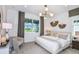 Relaxing main bedroom featuring ample natural light and neutral tones to promote rest at 9535 Coastline Way, Parrish, FL 34219