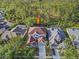 Overhead shot of home highlighting roof, trees, pool, and neighborhood at 10130 Deercliff Dr, Tampa, FL 33647
