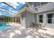 A beautiful backyard pool with an outdoor patio for entertaining, with a screen enclosure at 10130 Deercliff Dr, Tampa, FL 33647