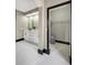 Modern bathroom with vanity, storage, and walk-in closet at 10130 Deercliff Dr, Tampa, FL 33647