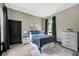 Comfortable bedroom with wood-look floors, neutral walls, and a window offering natural light at 10130 Deercliff Dr, Tampa, FL 33647