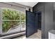 Unique bedroom window showing view of exterior trees at 10130 Deercliff Dr, Tampa, FL 33647
