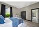 Spacious bedroom features a large window, walk-in closet, and an ensuite bathroom entrance at 10130 Deercliff Dr, Tampa, FL 33647