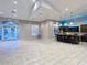 Clubhouse social room with tiled floors, island with bar seating, and an abundance of natural light at 10130 Deercliff Dr, Tampa, FL 33647