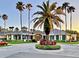 Inviting clubhouse entrance with lush landscaping, colorful decorations, and a welcoming ambiance at 10130 Deercliff Dr, Tampa, FL 33647