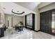 Elegant dining room featuring a modern light fixture, large window, and stylish decor at 10130 Deercliff Dr, Tampa, FL 33647