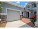 Charming two-story home showcasing stone accents and a well-maintained front lawn, inviting curb appeal at 10130 Deercliff Dr, Tampa, FL 33647