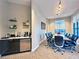 Modern meeting room with a large table, comfortable chairs, and refreshment station for professional gatherings at 10130 Deercliff Dr, Tampa, FL 33647