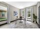 Bright home office with hardwood flooring, natural light and neutral colored walls at 10130 Deercliff Dr, Tampa, FL 33647