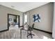 Bright home office with wood desk, stylish decor, and a view into the formal living room at 10130 Deercliff Dr, Tampa, FL 33647