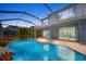 Inviting outdoor pool area with an extended patio and a screened-in lanai for relaxed outdoor living at 10130 Deercliff Dr, Tampa, FL 33647