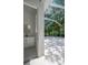 Poolside bathroom with vanity, offers convenient access and adds functionality to the outdoor entertainment area at 10130 Deercliff Dr, Tampa, FL 33647