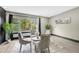 Cozy sitting room offers a comfortable area with serene views of the lush outdoors at 10130 Deercliff Dr, Tampa, FL 33647