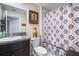 Bathroom with granite countertop and a decorative purple shower curtain at 10229 Bright Crystal Ave, Riverview, FL 33578