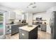 An updated kitchen features granite countertops, stainless steel appliances and ample cabinet space at 10308 Boyette Creek Blvd, Riverview, FL 33569