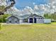 Charming single-story home with a well-manicured lawn and inviting curb appeal at 11268 Shivering Owl Ave, Weeki Wachee, FL 34614