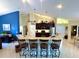 Kitchen with granite countertops, stainless steel appliances, and barstool seating at 11268 Shivering Owl Ave, Weeki Wachee, FL 34614