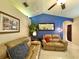 Comfortable living room with vaulted ceilings, tile flooring, and comfortable leather seating at 11268 Shivering Owl Ave, Weeki Wachee, FL 34614