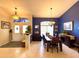 Inviting view of the living and dining rooms showcasing an open floor plan and stylish decor at 11268 Shivering Owl Ave, Weeki Wachee, FL 34614
