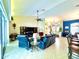 Spacious living room showcasing tile floors, vaulted ceilings, and access to a pool at 11268 Shivering Owl Ave, Weeki Wachee, FL 34614