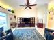 Bright living room featuring tile floors, vaulted ceilings, and comfortable seating at 11268 Shivering Owl Ave, Weeki Wachee, FL 34614