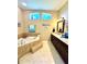 Soaking tub and dual windows bring natural light into this spa-like main bathroom at 11268 Shivering Owl Ave, Weeki Wachee, FL 34614