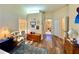 Spacious main bedroom featuring hardwood floors, neutral colors, and bright, natural light at 11268 Shivering Owl Ave, Weeki Wachee, FL 34614