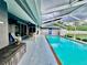 Beautiful screened-in pool and patio area with plenty of space for lounging and relaxation with easy access to home at 11268 Shivering Owl Ave, Weeki Wachee, FL 34614